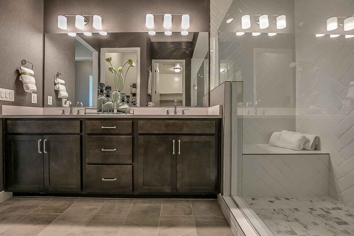 Modern walk-in shower with bench seating and premium glass enclosure