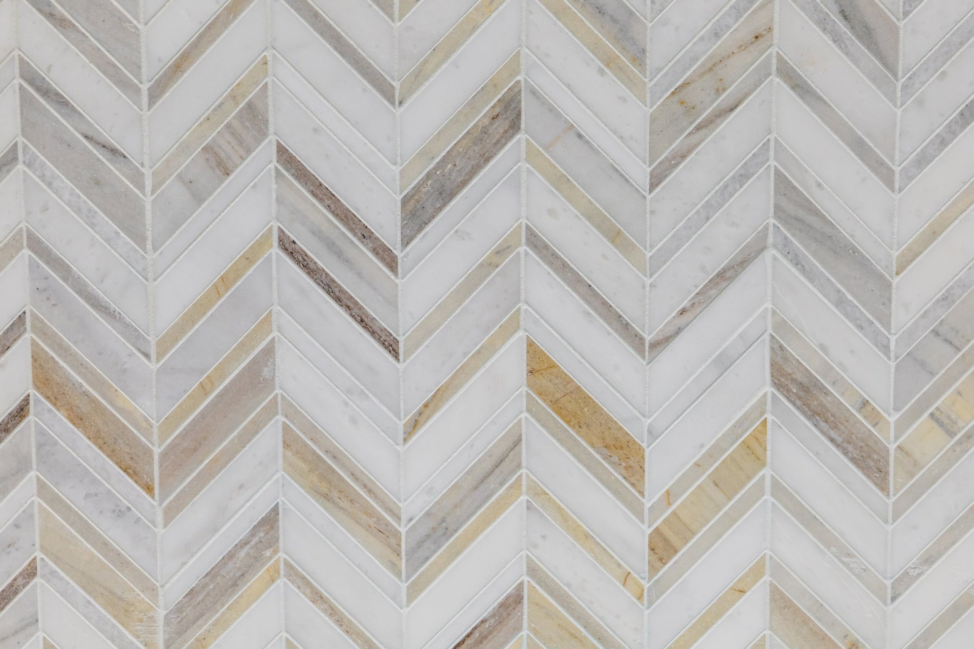 White, gray and brown marble herringbone tile