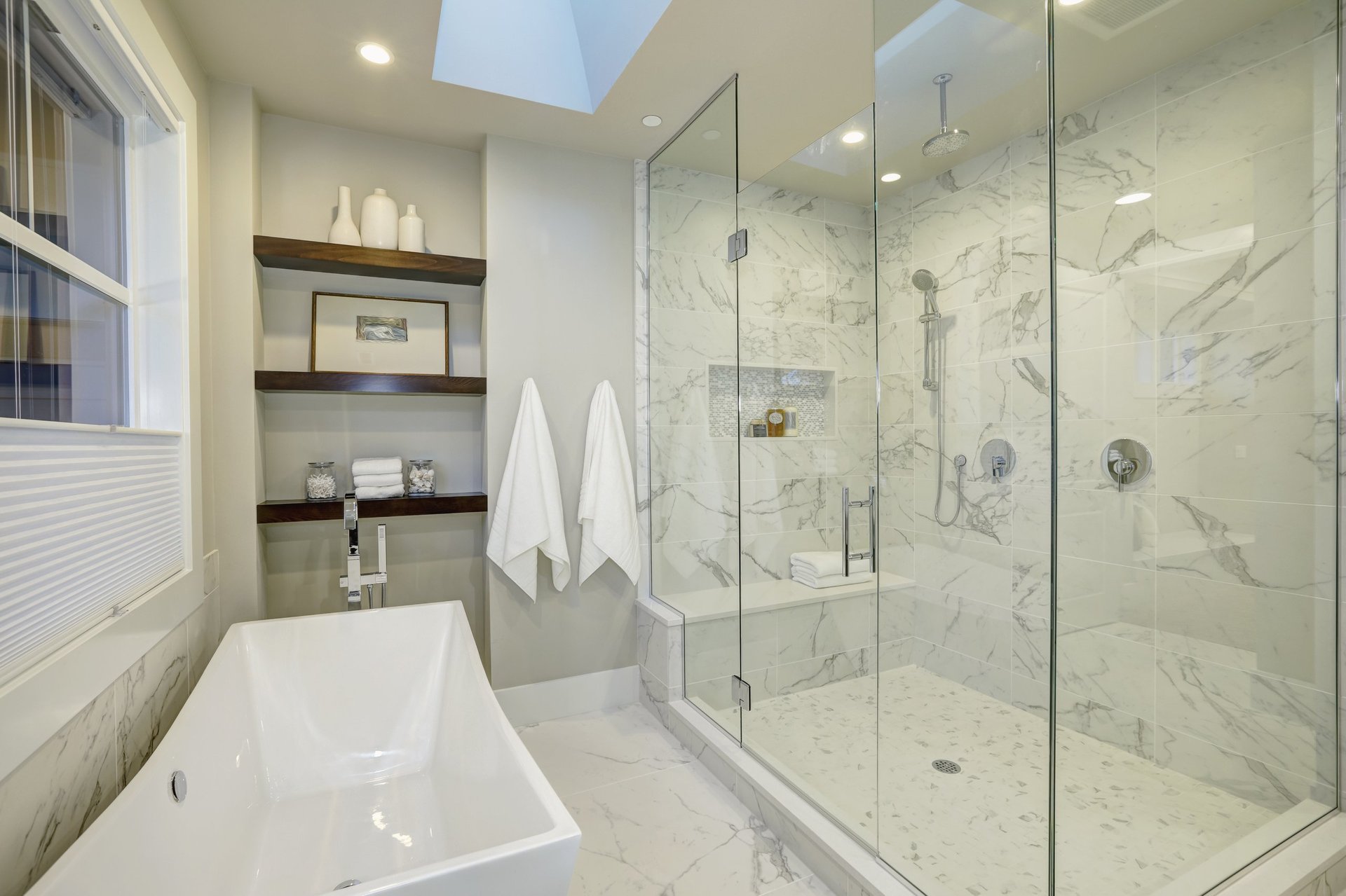 Amazing white and gray marble master bathroom with large glass walk-in shower